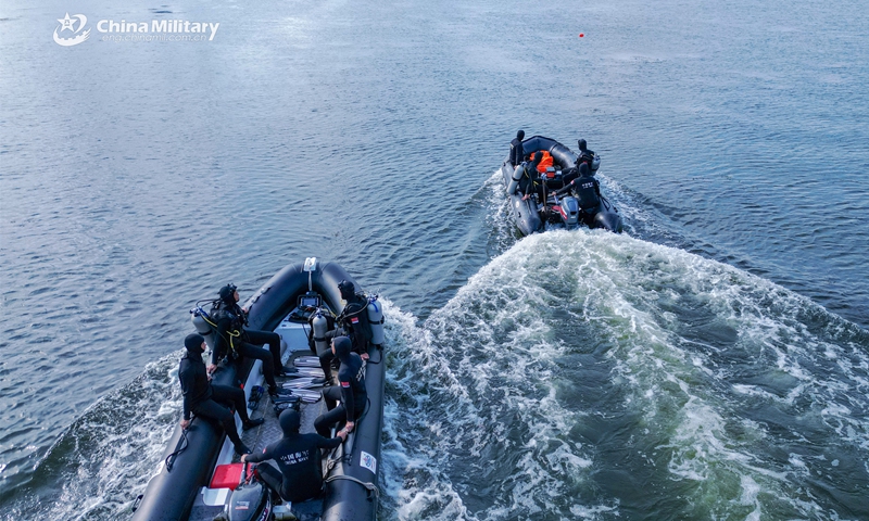 Frogmen assigned to a mine countermeasures (MCM) detachment of the navy under the PLA Eastern Theater Command manipulate their combat rubber raiding crafts (CRRC) to the designated waters during an explosive ordnance disposal and diving training exercise on September 17, 2023. (eng.chinamil.com.cn/Photo by Guo Qun)