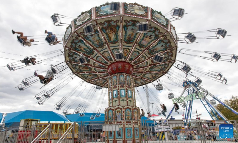 People have fun at State Fair of Texas in Dallas, the United States, Oct. 5, 2023. The annual State Fair of Texas is held in Dallas from Sept. 29 till Oct. 22. (Photo by Dan Tian/Xinhua)