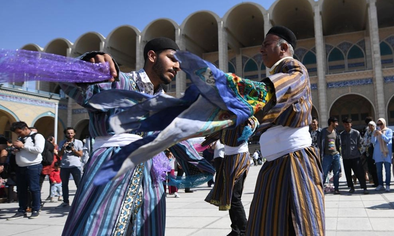 People in traditional costumes perform in Tehran, Iran, Oct. 5, 2023. People from all parts of the country gathered here to exhibit and sell traditional products. (Xinhua/Shadati)

