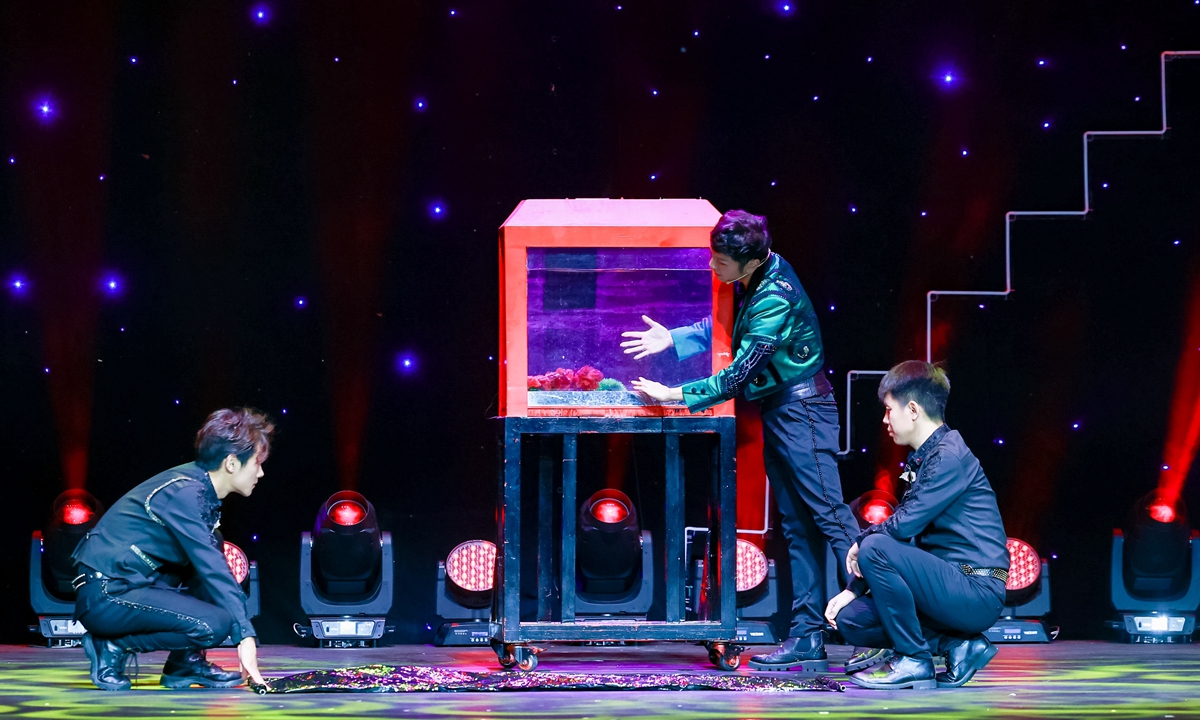 Magicians perform on the stage Photo: Courtesy of International Magic Carnival and World University Magic Exchange Conference