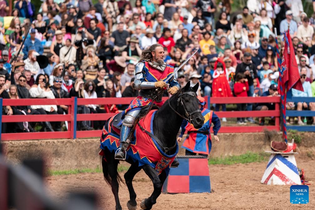 A rider dressed in costumes performs during Texas Renaissance Festival in Todd Mission, Texas, the United States, Oct. 7, 2023. Texas Renaissance Festival kicked off in the western U.S. state of Texas on Saturday, bringing the magic of the Renaissance time to life through Nov. 26.(Photo: Xinhua)