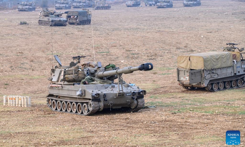 This photo taken on Oct. 8, 2023 shows Israeli military vehicles in northern Israel near the border with Lebanon. Dozens of rockets and heavy artillery shells were fired toward Israeli positions on the Shebaa Farms, a disputed strip of land at the intersection of the Lebanese-Syrian border and the Israeli-annexed Golan Heights, early Sunday morning, Lebanese army intelligence sources confirmed to Xinhua.(Photo: Xinhua)