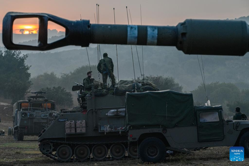 This photo taken on Oct. 8, 2023 shows Israeli military vehicles in northern Israel near the border with Lebanon. Dozens of rockets and heavy artillery shells were fired toward Israeli positions on the Shebaa Farms, a disputed strip of land at the intersection of the Lebanese-Syrian border and the Israeli-annexed Golan Heights, early Sunday morning, Lebanese army intelligence sources confirmed to Xinhua.(Photo: Xinhua)