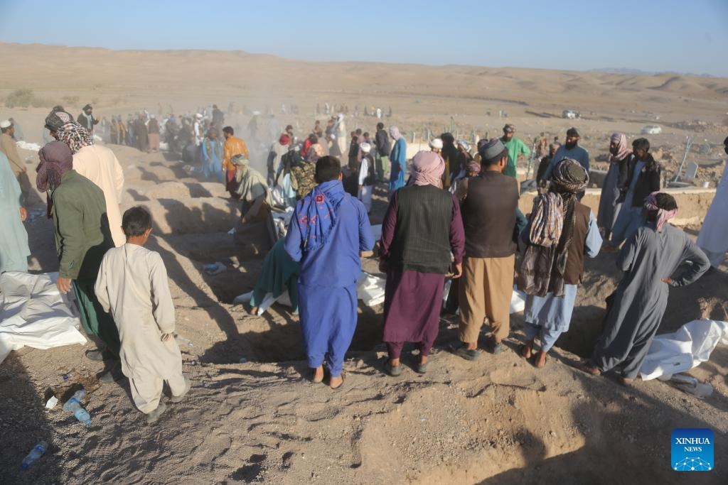 A mass funeral following deadly earthquakes is held in the Zindajan district, Herat province, western Afghanistan, on Oct. 9, 2023. Thousands of people have been left homeless in west Afghanistan's Herat province in the wake of devastating earthquakes that struck Herat and its neighboring Farah and Badghis provinces on Saturday. The two deadly quakes, according to the China Earthquake Networks Center, each with a magnitude of 6.2 followed by several aftershocks rocked west Afghanistan.(Photo: Xinhua)