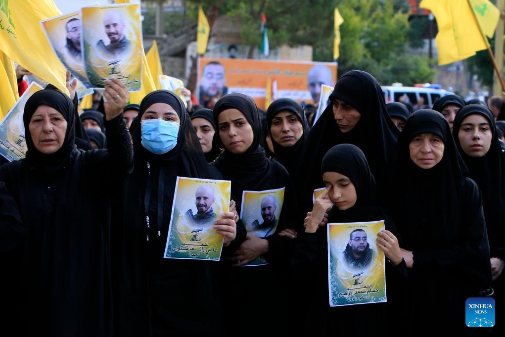 Supporters mourn Hezbollah members killed in Israeli strikes during a funeral in the town of Khirbet Selm, southern Lebanon, on Oct. 10, 2023.(Photo: Xinhua)