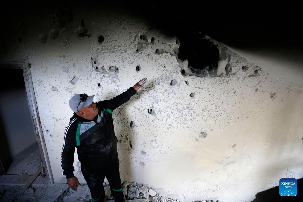 A man inspects a house damaged in Israeli artillery shelling in the town of Al-Dhayra, Lebanon, on Oct. 11, 2023. The Israeli strikes on border villages and towns in southern Lebanon on Wednesday morning injured three people and caused heavy damage to property and agricultural fields, Lebanon's National News Agency (NNA) reported.(Photo: Xinhua)