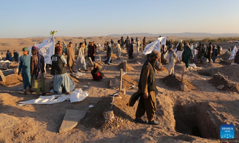 A mass funeral following deadly earthquakes is held in the Zindajan district, Herat province, western Afghanistan, on Oct. 9, 2023. Thousands of people have been left homeless in west Afghanistan's Herat province in the wake of devastating earthquakes that struck Herat and its neighboring Farah and Badghis provinces on Saturday. The two deadly quakes, according to the China Earthquake Networks Center, each with a magnitude of 6.2 followed by several aftershocks rocked west Afghanistan.(Photo: Xinhua)