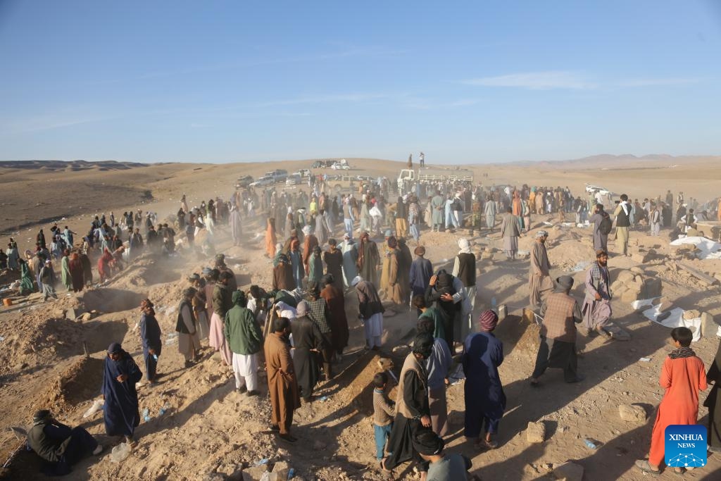 A mass funeral following deadly earthquakes is held in the Zindajan district, Herat province, western Afghanistan, on Oct. 9, 2023. Thousands of people have been left homeless in west Afghanistan's Herat province in the wake of devastating earthquakes that struck Herat and its neighboring Farah and Badghis provinces on Saturday. The two deadly quakes, according to the China Earthquake Networks Center, each with a magnitude of 6.2 followed by several aftershocks rocked west Afghanistan.(Photo: Xinhua)