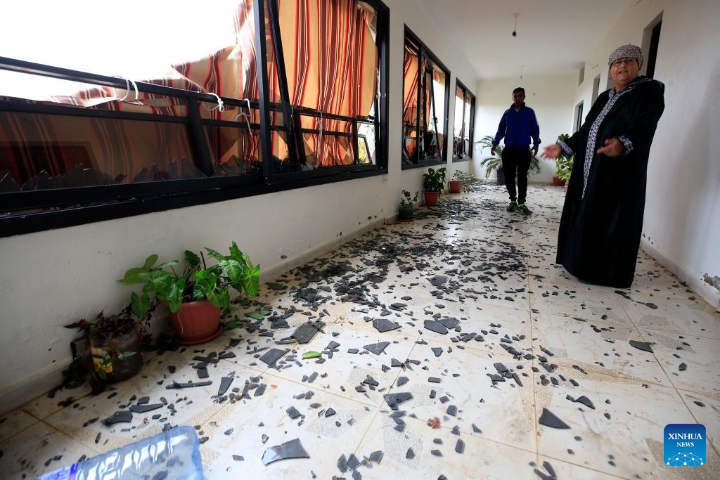 People inspect a house damaged in Israeli artillery shelling in the town of Al-Dhayra, Lebanon, on Oct. 11, 2023. The Israeli strikes on border villages and towns in southern Lebanon on Wednesday morning injured three people and caused heavy damage to property and agricultural fields, Lebanon's National News Agency (NNA) reported.(Photo: Xinhua)