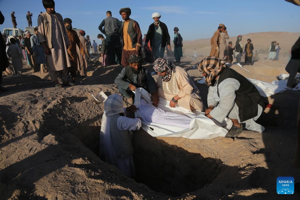 A mass funeral following deadly earthquakes is held in the Zindajan district, Herat province, western Afghanistan, on Oct. 9, 2023. Thousands of people have been left homeless in west Afghanistan's Herat province in the wake of devastating earthquakes that struck Herat and its neighboring Farah and Badghis provinces on Saturday. The two deadly quakes, according to the China Earthquake Networks Center, each with a magnitude of 6.2 followed by several aftershocks rocked west Afghanistan.(Photo: Xinhua)