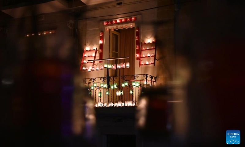 Lit candles are seen during a candlelight festival in Birgu, Malta, Oct. 14, 2023. The candlelight festival was held here on Friday and Saturday. The candlelight illuminated Birgu's winding and narrow medieval streets. Many residents in Birgu lit up their homes and balconies with candles and opened their doors to visitors. (Photo:Xinhua)