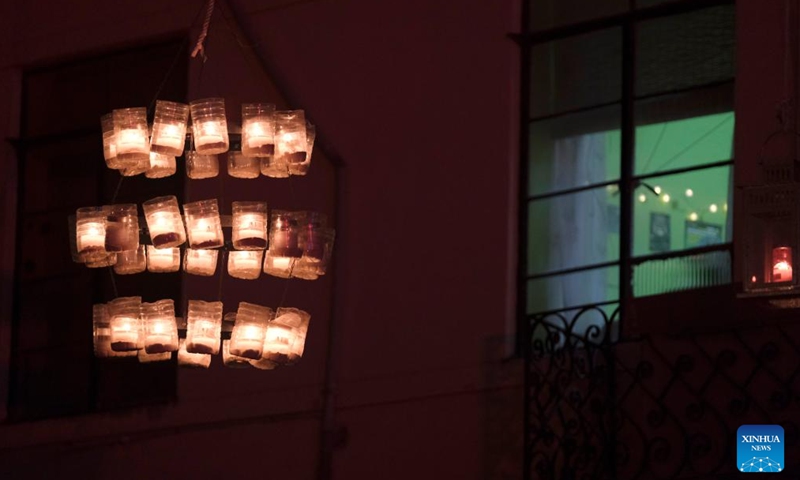 Lit candles are seen during a candlelight festival in Birgu, Malta, Oct. 14, 2023. The candlelight festival was held here on Friday and Saturday. The candlelight illuminated Birgu's winding and narrow medieval streets. Many residents in Birgu lit up their homes and balconies with candles and opened their doors to visitors. (Photo:Xinhua)