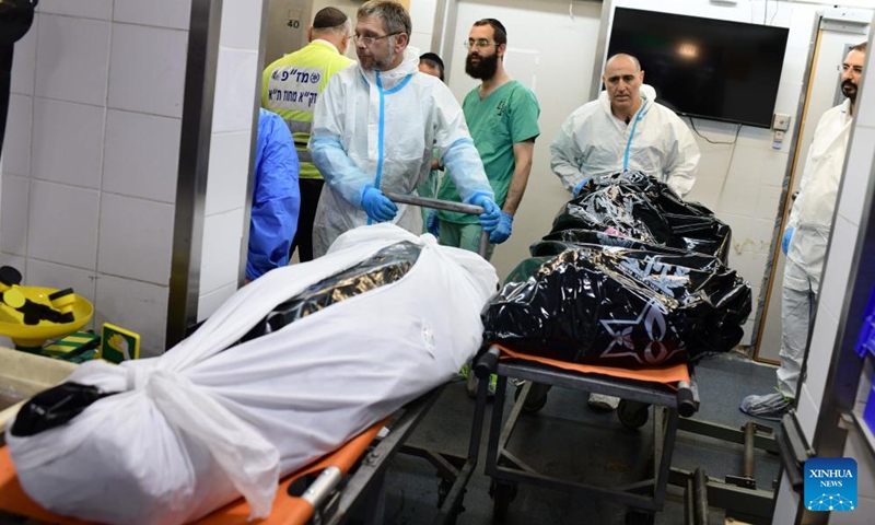 Forensic experts work at the National Center for Forensic Medicine in Tel Aviv, Israel, on Oct. 16, 2023. At least 2,750 Palestinians were killed by the Israeli army in Gaza, while in Israel, the death toll was at least 1,284 as of Sunday, according to official figures from the two sides.(Photo: Xinhua)