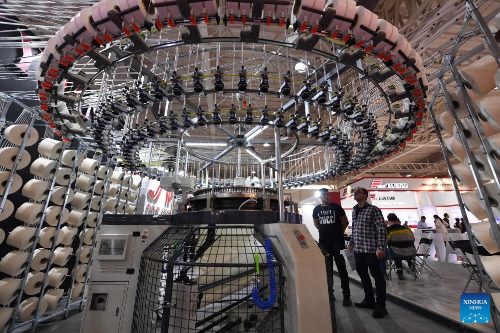 People visit a textile exhibition in Tehran, Iran, Oct. 15, 2023. Iran's international textile exhibition kicked off in the capital Tehran on Sunday with the participation of textile companies from 11 countries and regions.(Photo: Xinhua)