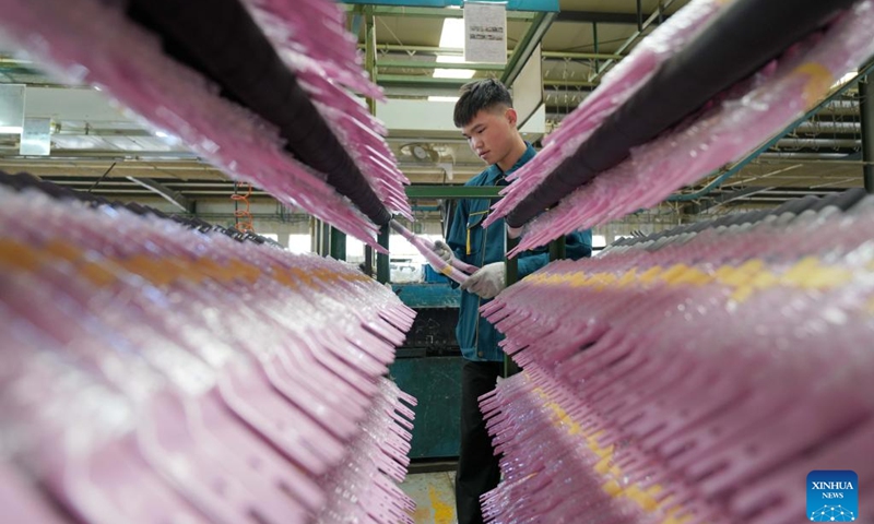 A worker arranges parts of children bicycles at a manufacturing company in Pingxiang County, north China's Hebei Province, Oct. 16, 2023. Pingxiang, dubbed the city of children wheels, has made great efforts in boosting its children bicycle business in recent years. Products here have been sold to over 60 countries and regions including Russia, Vietnam, Kenya and Sri Lanka.(Photo: Xinhua)