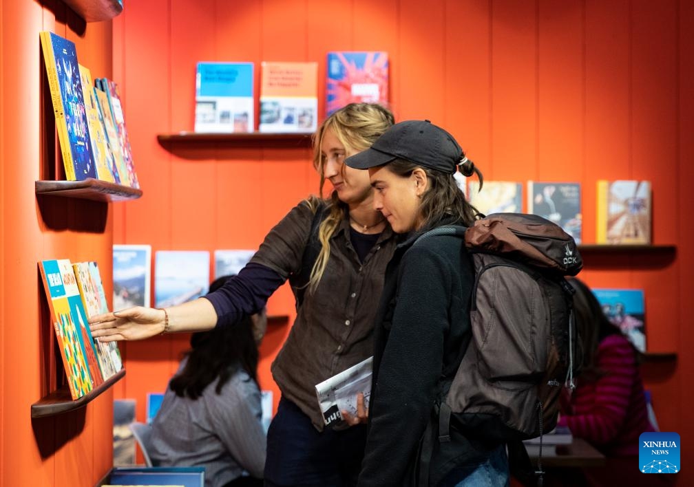 People visit the 75th Frankfurt Book Fair in Frankfurt, Germany, Oct. 18, 2023. The 75th Frankfurt Book Fair opened its doors to visitors on Wednesday. The book fair focuses on the most pressing issues related to literature and society, its organizers said.(Photo: Xinhua)