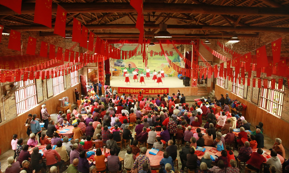 Nearly 1,000 seniors dine together and watch performances in a village in Wuzhou, South China's Guangxi Zhuang Autonomous Region, on October 22, 2023, to celebrate the Chongyang Festival, which falls on October 23 this year. The Chongyang Festival, which falls on the ninth day of the ninth month of the Chinese lunar calendar, promotes respect and care for seniors. Photo: VCG