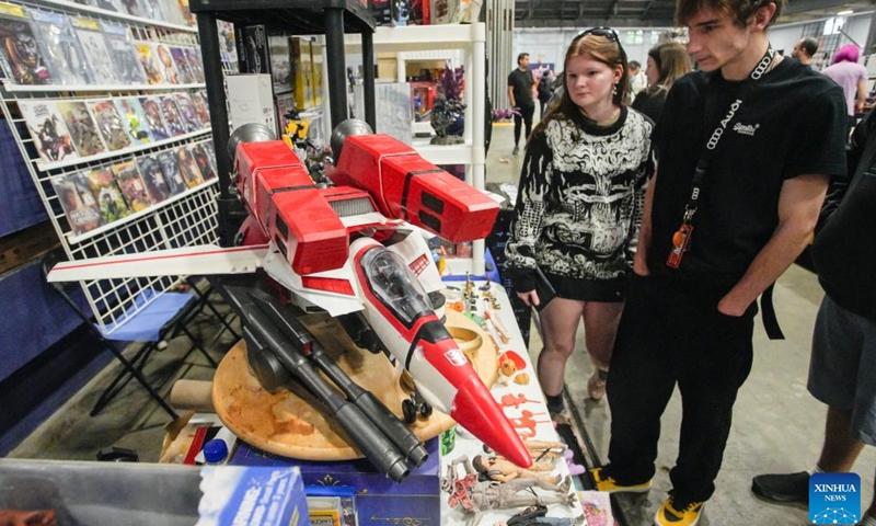 People visit the Vancouver Comic and Toy Show in Vancouver, British Columbia, Canada, on Oct. 21, 2023. The Vancouver Comic and Toy Show, a two-day event over the weekend, features a vast array of collectible toys, superhero memorabilia, comic books, and pop culture items, drawing thousands of collectors and enthusiasts. (Photo: Xinhua)