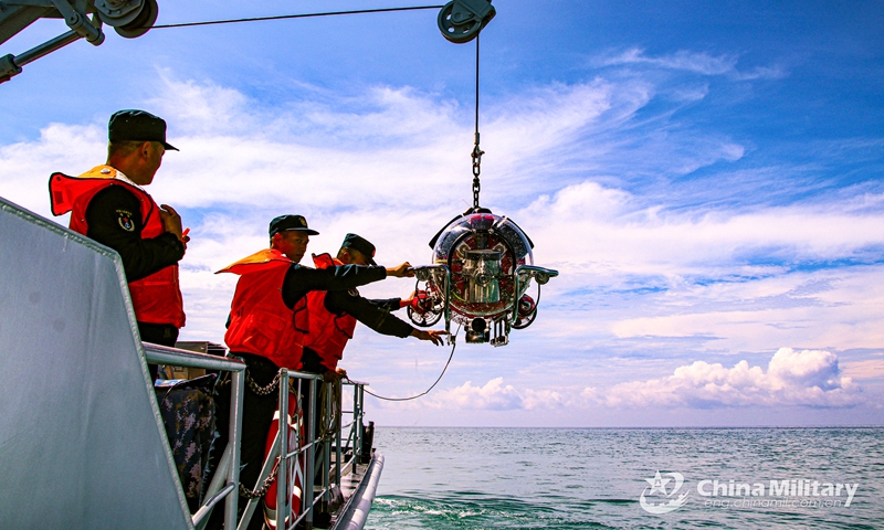 Sailors assigned to a naval minesweeper flotilla of the PLA Navy deploy mine neutralization vehicle during a round-the-clock mine-countermeasures (MCM) training exercise. The exercise, which was held in unfamiliar sea areas from September 9 to September 13, aimed to hone the troops' combat capabilities. (eng.chinamil.com.cn/Photo by Du Jialei)