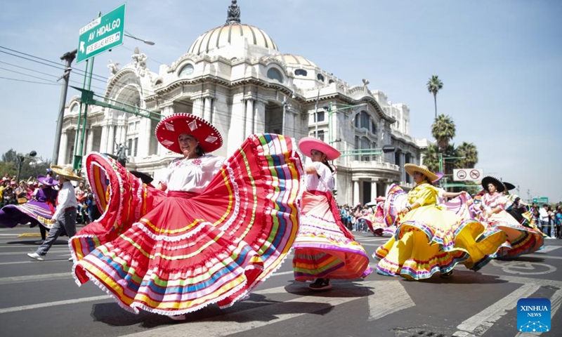 People take part in the Monumental Alebrijes Parade 2023 in Mexico City, capital of Mexico, Oct. 21, 2023. Alebrijes are brightly colored folk art sculptures of fantastical creatures. (Photo: Xinhua)