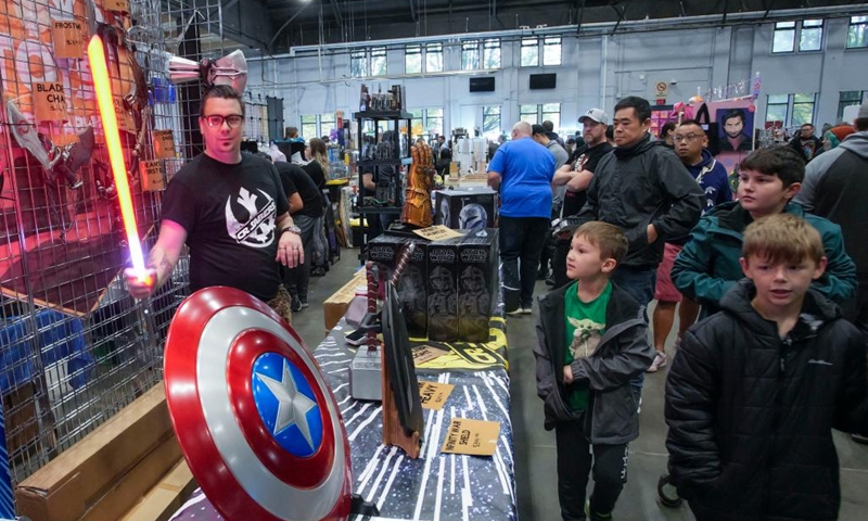 People visit the Vancouver Comic and Toy Show in Vancouver, British Columbia, Canada, on Oct. 21, 2023. The Vancouver Comic and Toy Show, a two-day event over the weekend, features a vast array of collectible toys, superhero memorabilia, comic books, and pop culture items, drawing thousands of collectors and enthusiasts. (Photo: Xinhua)