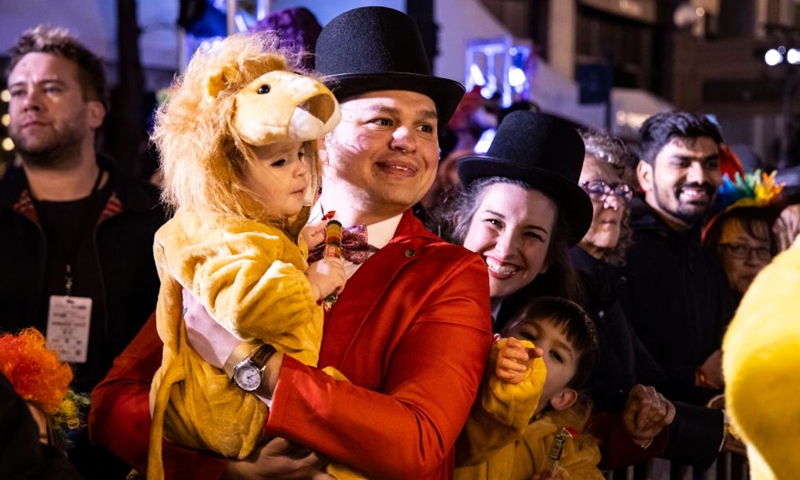 Costumed spectators are pictured at the Art in the Dark Halloween Parade on State Street in downtown Chicago, the United States, Oct. 21, 2023. (Photo: Xinhua)