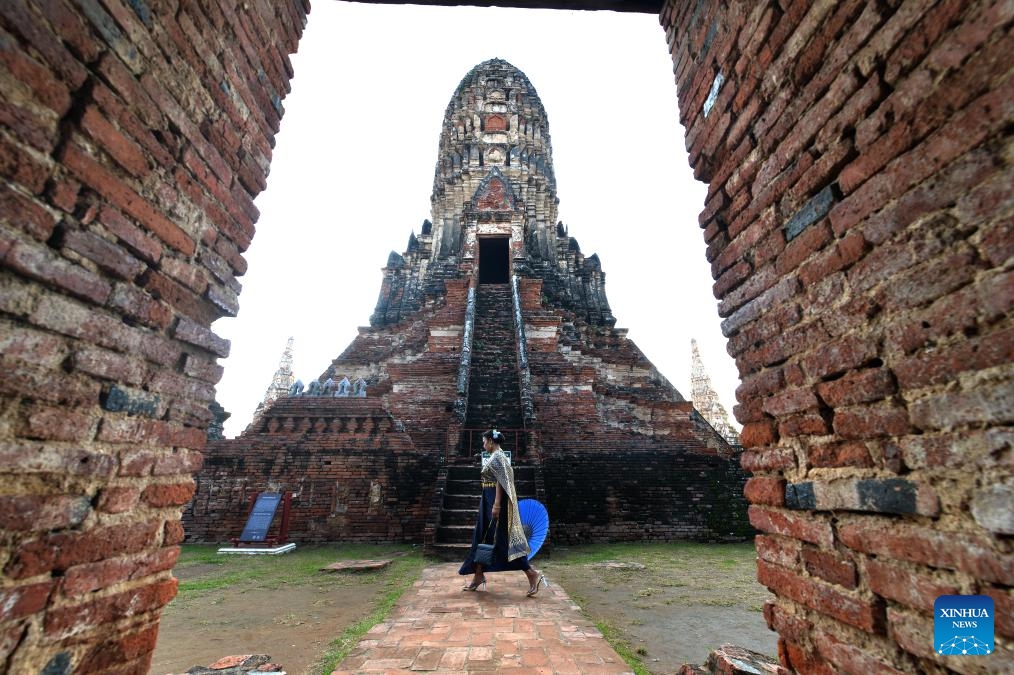 A tourist is seen at the Ayutthaya Historical Park in Ayutthaya, Thailand, Oct. 22, 2023. Located in central Thailand, Ayutthaya was founded around 1350 and is the famous ancient capital of Thailand. In 1991, the ancient city of Ayutthaya was listed as a UNESCO World Heritage Site with a protected area of 289 hectares.(Photo: Xinhua)