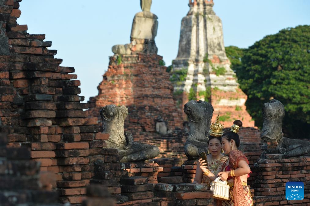 Tourists are seen at the Ayutthaya Historical Park in Ayutthaya, Thailand, Oct. 22, 2023. Located in central Thailand, Ayutthaya was founded around 1350 and is the famous ancient capital of Thailand. In 1991, the ancient city of Ayutthaya was listed as a UNESCO World Heritage Site with a protected area of 289 hectares.(Photo: Xinhua)