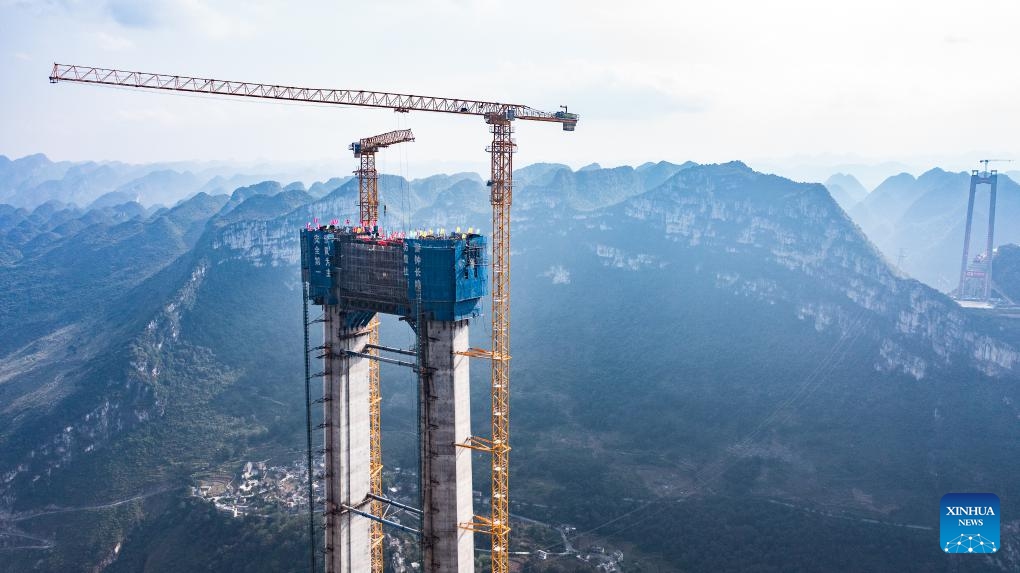 This aerial photo taken on Oct. 24, 2023 shows a main tower of the Huajiang grand canyon bridge in southwest China's Guizhou Province. The last main tower of the Huajiang grand canyon bridge was completed on Tuesday in southwest China's Guizhou Province, marking a major milestone in the building of the world's highest bridge.(Photo: Xinhua)