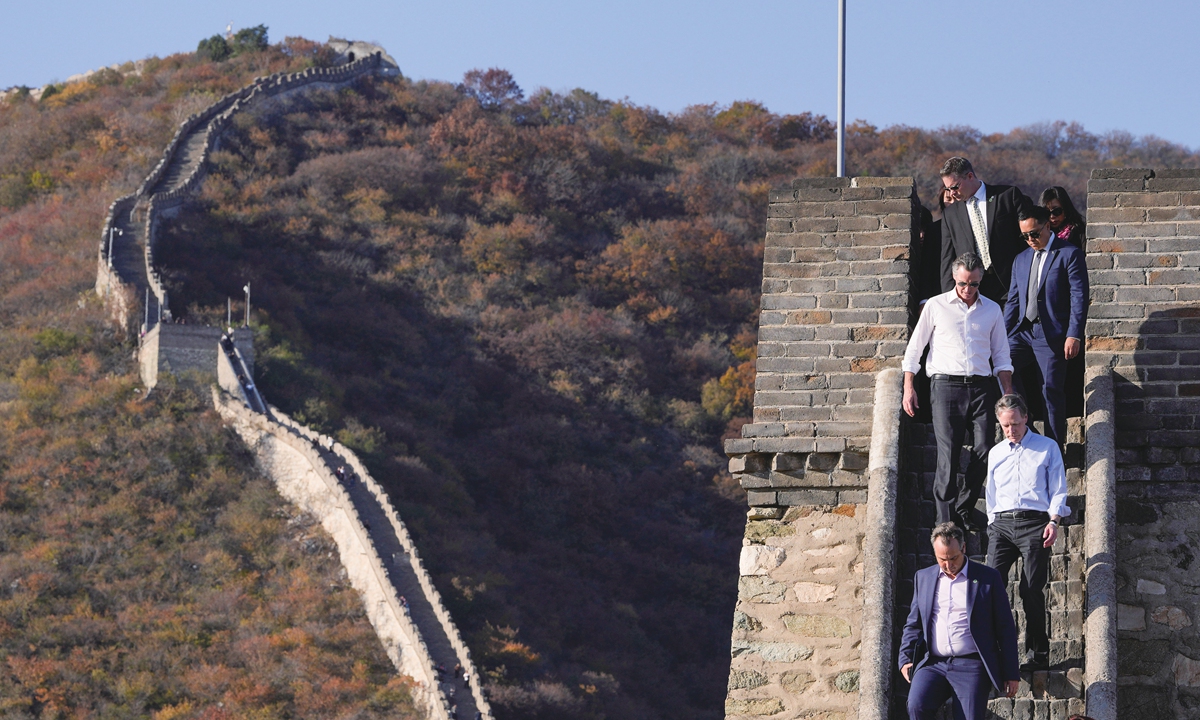 California Governor Gavin Newsom (third from top) visits the Mutianyu Great Wall with US Ambassador to China Nicholas Burns (fourth from top) on October 26, 2023, in Beijing. Newsom began his week-long trip to China on October 23 and met with China's top leader on October 25. Photo: VCG