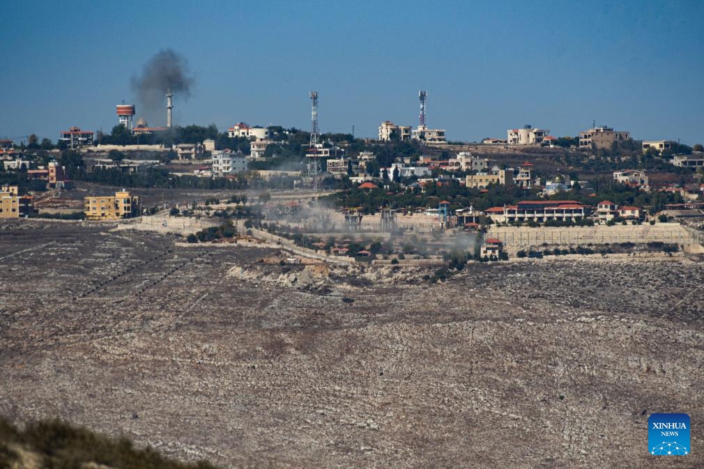 Smoke rises from a hill of a southern Lebanese village, as seen from Israeli Moshav of Avivim in northern Israel bordering Lebanon, following artillery shelling by the Israeli army, on Oct. 25, 2023.(Photo: Xinhua)