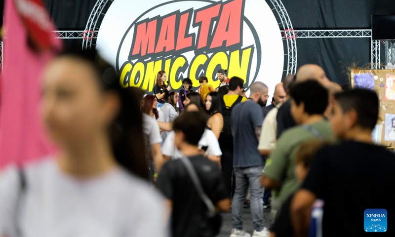 People visit the Malta Comic Con at the Malta Fairs and Conventions Center in Ta'Qali, Malta, Oct. 28, 2023. (Photo: Xinhua)