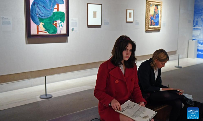 Girls make sketches of artworks during the exhibition Vertigo of Color: Matisse, Derain, and the Origins of Fauvism at the Metropolitan Museum of Art in New York, the United States, on Oct. 26, 2023. (Photo: Xinhua)