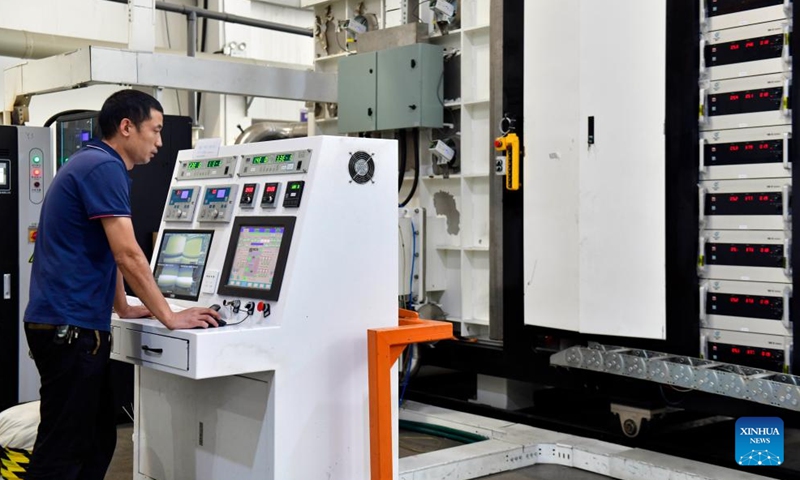 Staff members work at a new material company in Dingtao District of Heze City, east China's Shandong Province, Oct. 29, 2023. In recent years, Dingtao District of Heze City has continuously developed characteristic industries including biomedicine industry and new materials, so as to promote high-quality economic development. (Photo: Xinhua)