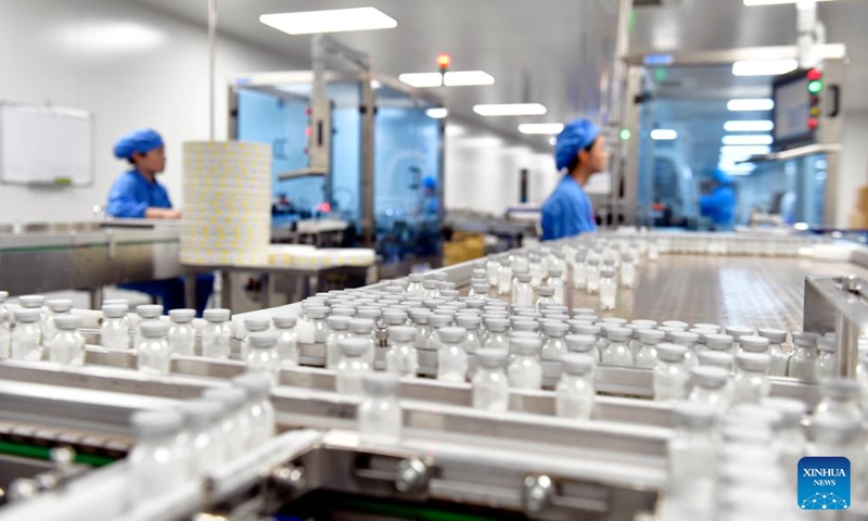 Staff members work at a pharmaceutical company in Dingtao District of Heze City, east China's Shandong Province, Oct. 29, 2023. In recent years, Dingtao District of Heze City has continuously developed characteristic industries including biomedicine industry and new materials, so as to promote high-quality economic development. (Photo: Xinhua)