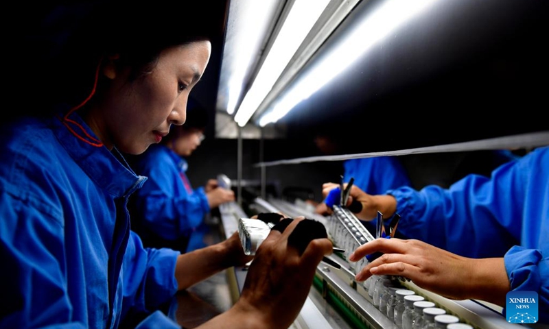 Staff members work at a pharmaceutical company in Dingtao District of Heze City, east China's Shandong Province, Oct. 29, 2023. In recent years, Dingtao District of Heze City has continuously developed characteristic industries including biomedicine industry and new materials, so as to promote high-quality economic development. (Photo: Xinhua)