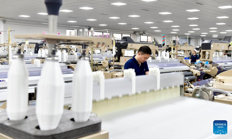 A staff member works at an industrial park in Dingtao District of Heze City, east China's Shandong Province, Oct. 28, 2023. In recent years, Dingtao District of Heze City has continuously developed characteristic industries including biomedicine industry and new materials, so as to promote high-quality economic development. (Photo: Xinhua)