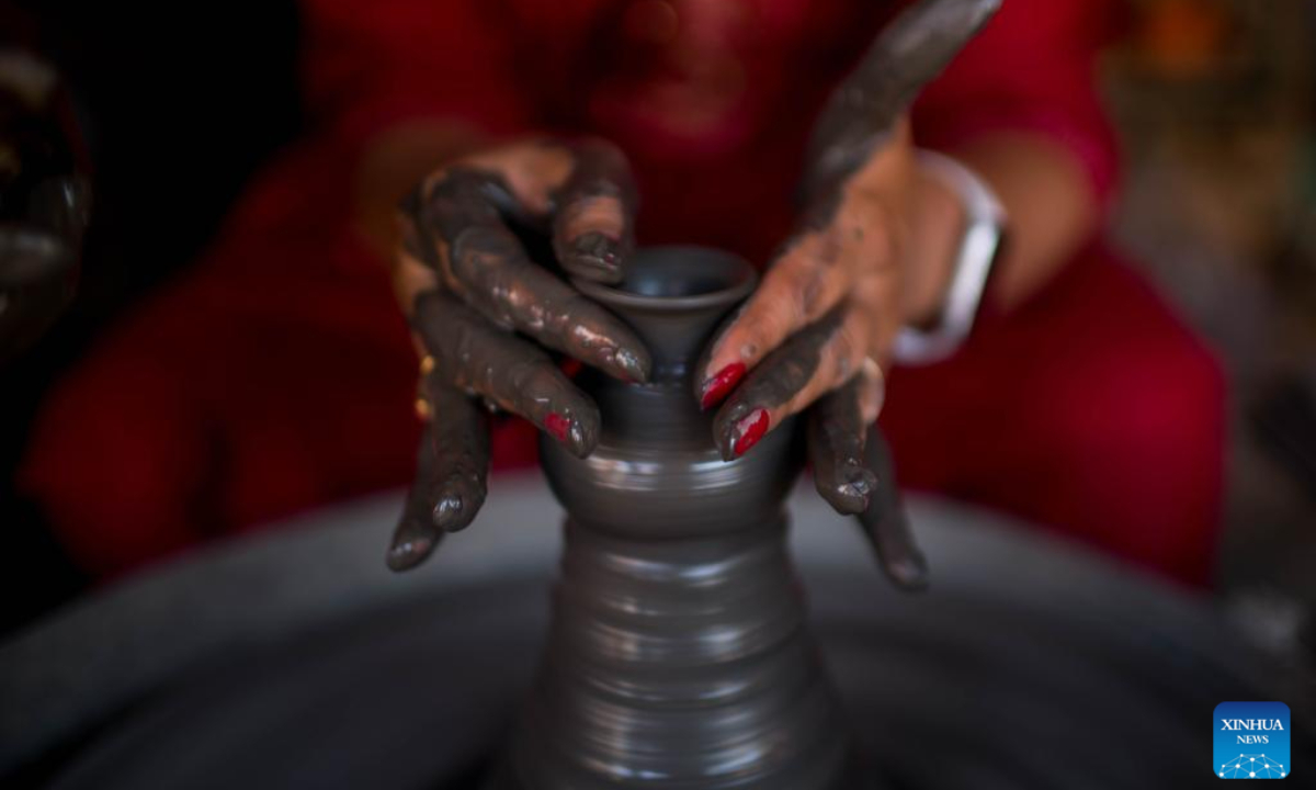 A worker makes a clay pot for Tihar, the Hindu festival of lights, in Bhaktapur, Nepal, Nov 10, 2023. This clay pot is used as an oil lamp during Tihar. Photo:Xinhua