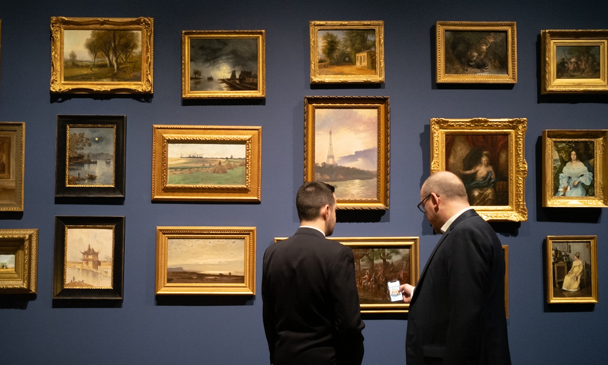 Visitors explore an exhibition at the Guardian Fine Art Asia in Beijing on October 31, 2023. Photo: VCG