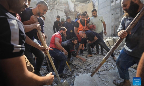 People In Gaza Conduct Rescue Work Among Rubble Of Buildings Destroyed ...