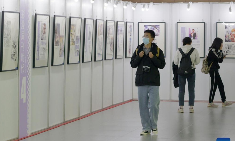 Comic enthusiasts visit an exhibition during the 19th World Comic Conference in Anyang, central China's Henan Province, Nov. 4, 2023. The five-day 19th World Comic Conference kicked off here on Saturday with 2,931 comic works from 29 countries and regions on display. (Photo: Xinhua)