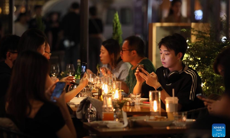 People are seen at a restaurant in Shanghai, east China, Nov. 3, 2023. The 6th China International Import Expo (CIIE) is scheduled to be held in Shanghai from Nov. 5 to 10. The expo showcases China's new development paradigm, a platform for high-standard opening up, and a public good for the whole world.  (Photo: Xinhua)