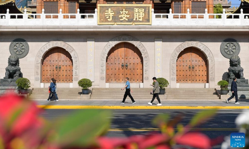 People walk past Jing'an Temple in Shanghai, east China, Nov. 3, 2023. The 6th China International Import Expo (CIIE) is scheduled to be held in Shanghai from Nov. 5 to 10. The expo showcases China's new development paradigm, a platform for high-standard opening up, and a public good for the whole world. (Photo: Xinhua)