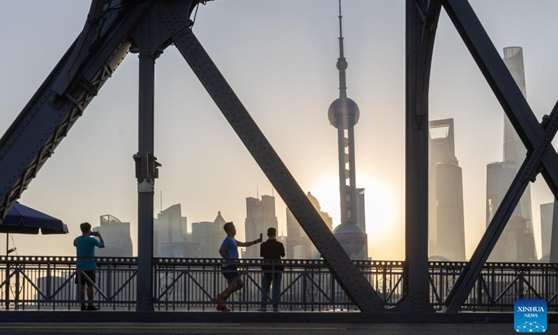 This photo taken on Nov. 3, 2023 shows a city view of Shanghai at sunrise. The 6th China International Import Expo (CIIE) is scheduled to be held in Shanghai from Nov. 5 to 10. The expo showcases China's new development paradigm, a platform for high-standard opening up, and a public good for the whole world. (Photo: Xinhua)