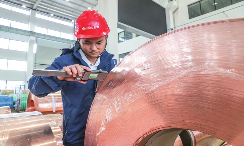 A worker manufactures high-performance copper and aluminum foil material for export on November 7, 2023 in Huzhou city, East China's Zhejiang Province. The enterprise has taken advantage of the Belt and Road Initiative to integrate more closely with the international market, while consistently elevating production quality. Photo: VCG