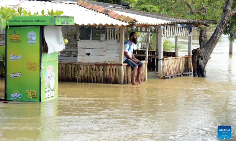 A man is seen from a store in Gampaha, Sri Lanka, on Nov. 8, 2023. Most of the areas in Gampaha district are flooded due to heavy rains in the past few days.(Photo: Xinhua)