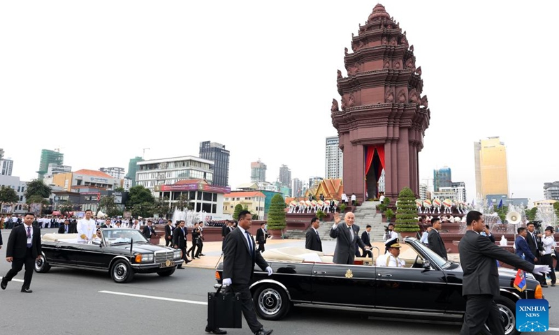 Cambodian King Norodom Sihamoni (in the front car) and Prime Minister Hun Manet (in the back car) attend the Independence Day celebration in Phnom Penh, Cambodia, Nov. 9, 2023.(Photo: Xinhua)