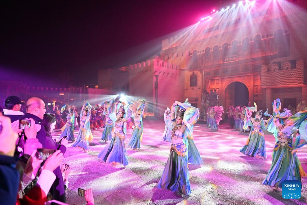 Artists perform at the Yotkan cultural scenic spot in Hotan County, northwest China's Xinjiang Uygur Autonomous Region, Nov. 7, 2023. The Yotkan cultural scenic spot is a small town featuring unique attraction that integrates culture, tourism, commerce and leisure. Performances elaborating its historical events are provided to tourists every night, allowing them to be immersed in the splendor of the ancient Silk Road.(Photo: Xinhua)