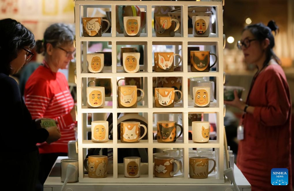 Ceramic mugs are seen at a vendor's booth at the Circle Craft Holiday Market in Vancouver, British Columbia, Canada, Nov. 8, 2023.(Photo: Xinhua)