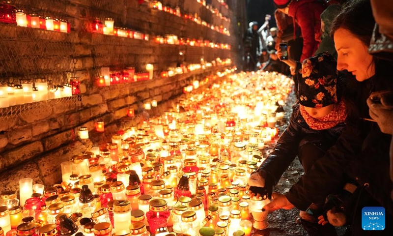 People gather to light candles during an event to mark the Latvian Freedom Fighters Remembrance Day, or Lacplesis Day, in Riga, Latvia, Nov. 11, 2023. (Photo: Xinhua)